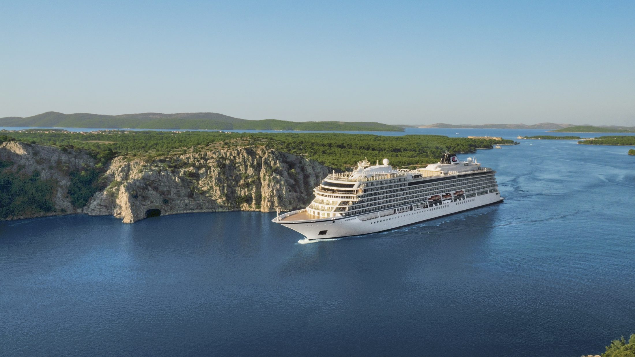 Viking ocean ship sailing a Dalmatian coast channel in Croatia
