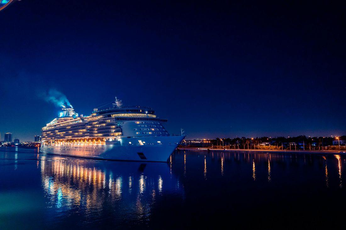 A cruise ship illuminated at night