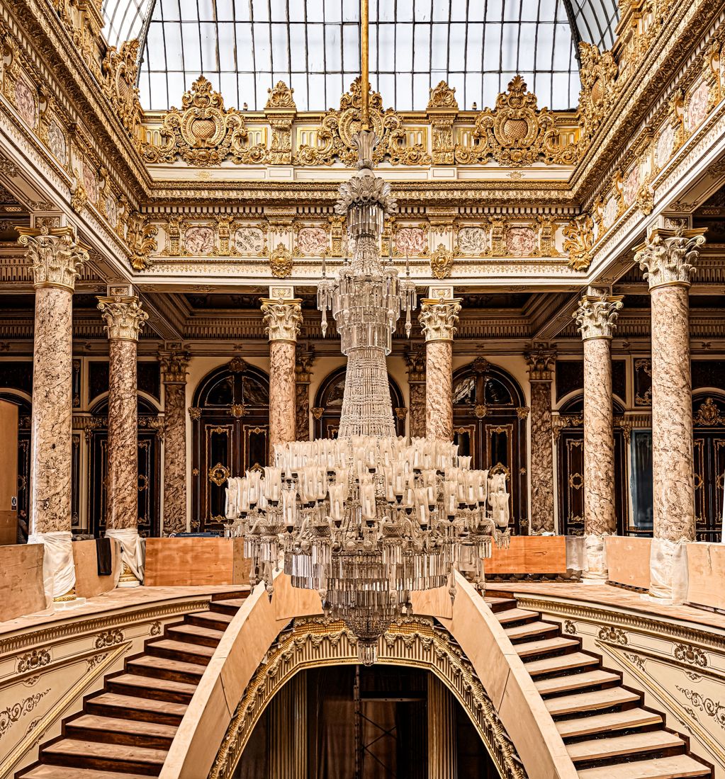 An elegant grand staircase aboard a cruise ship