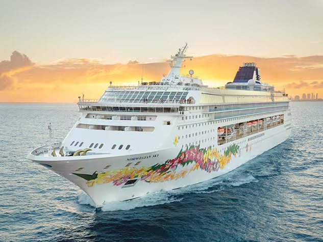 Norwegian Sky at sunset on open water