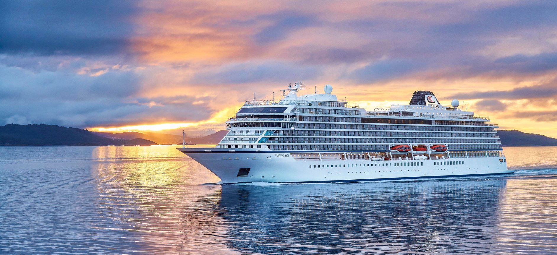 A Viking cruise ship under the midnight sun off the Lofoten Islands, Norway