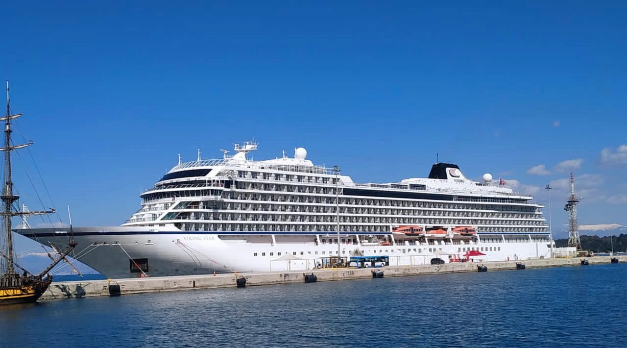A cruise ship moored at a Mediterranean port