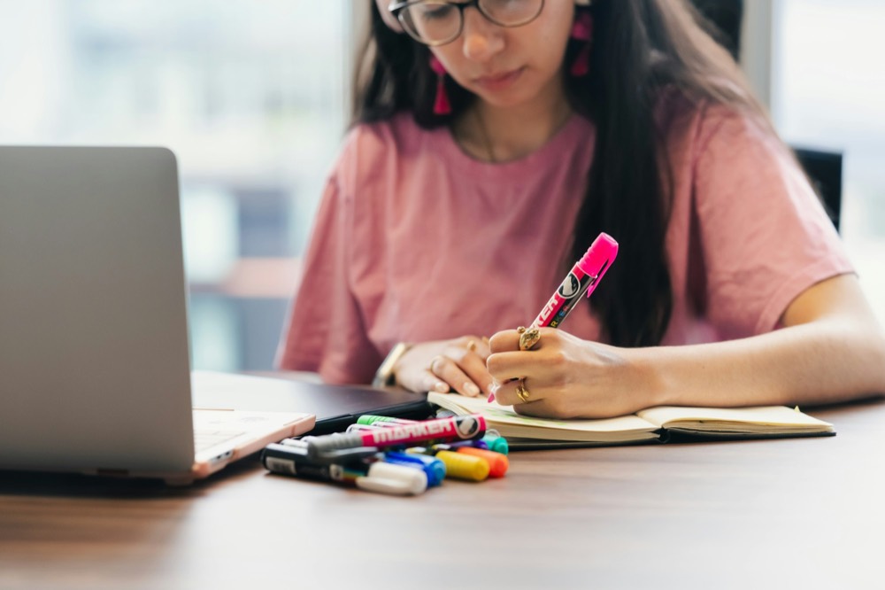 A candidate preparing documents and notes ahead of interviews
