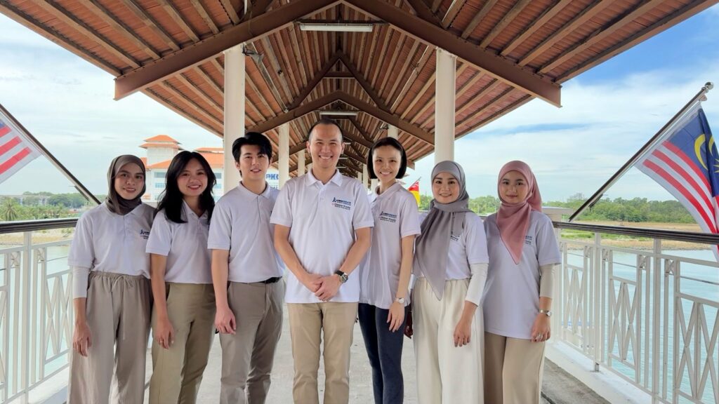The Jobs Kreate team at Port Klang Cruise Terminal with Malaysian flags during the Genting Dream cruise visit on 21 May 2026.