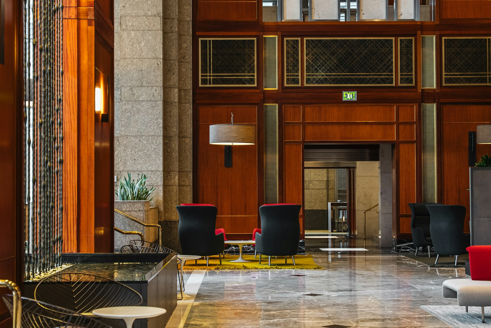 Elegant hotel lobby with modern seating and wood panelling