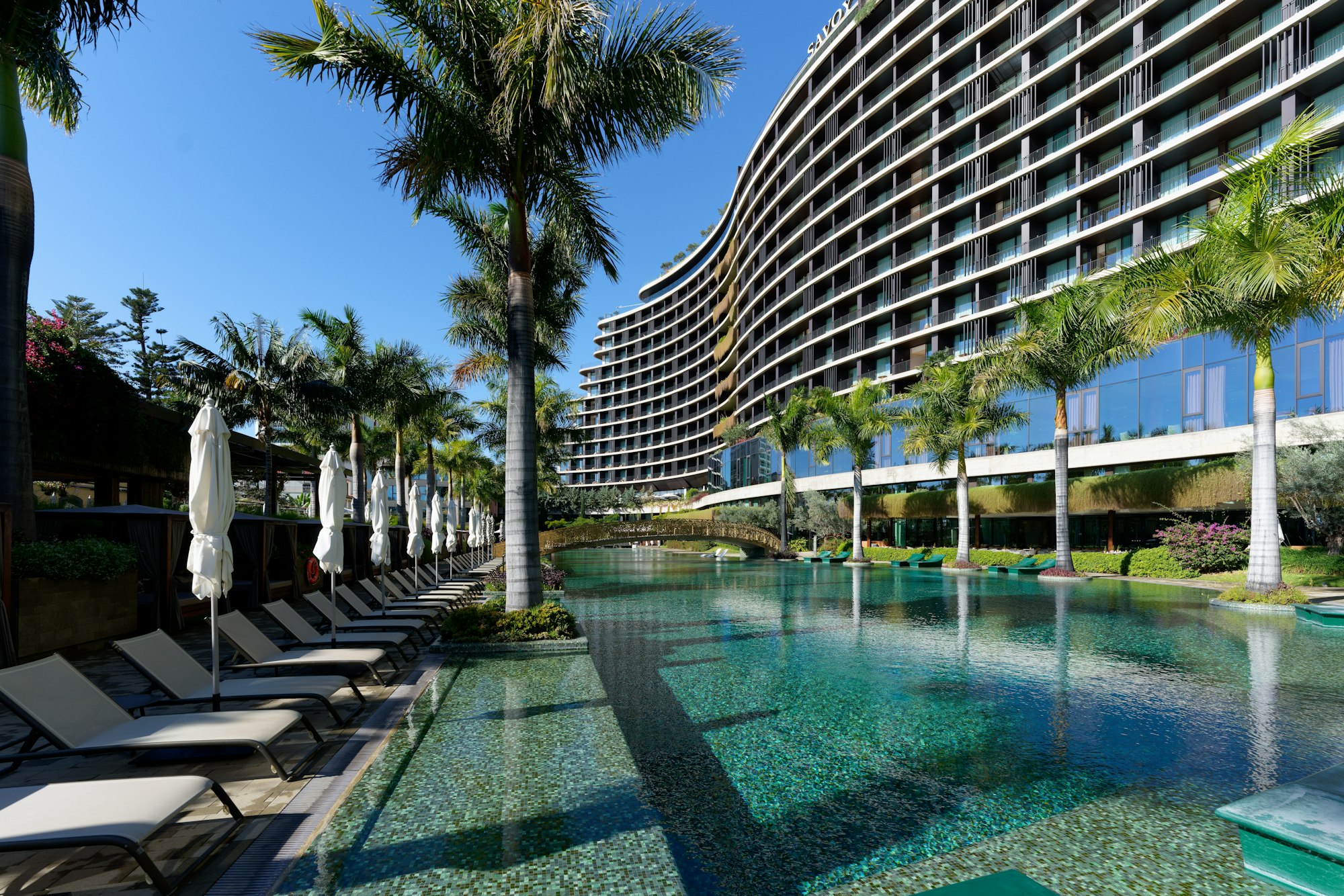 A luxury resort hotel with a large outdoor pool