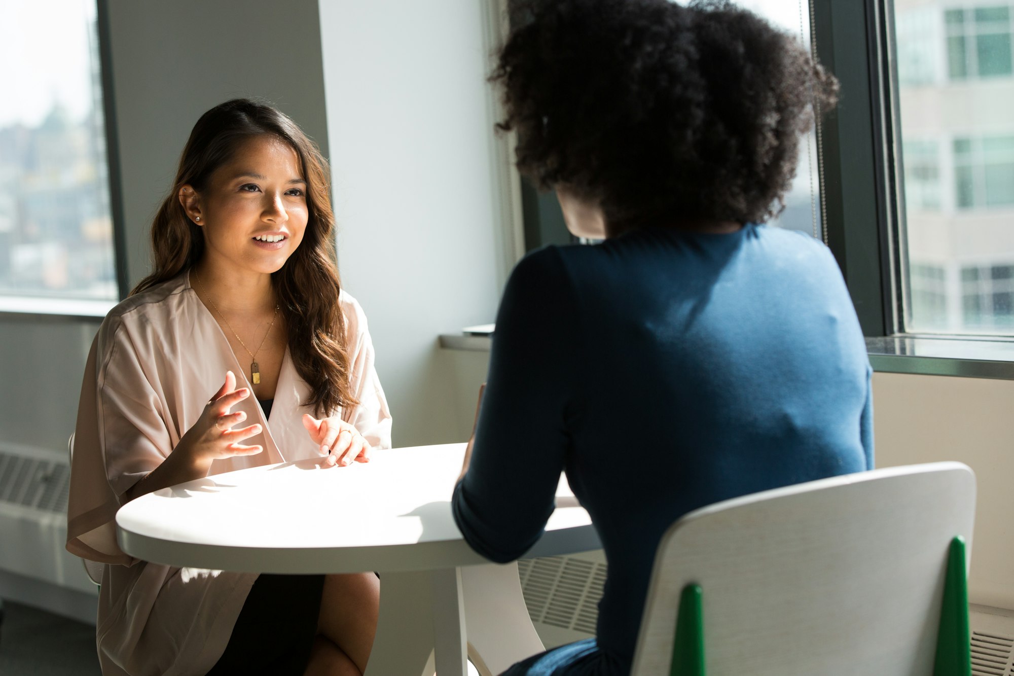 An employer screening a hospitality candidate in a one-to-one interview